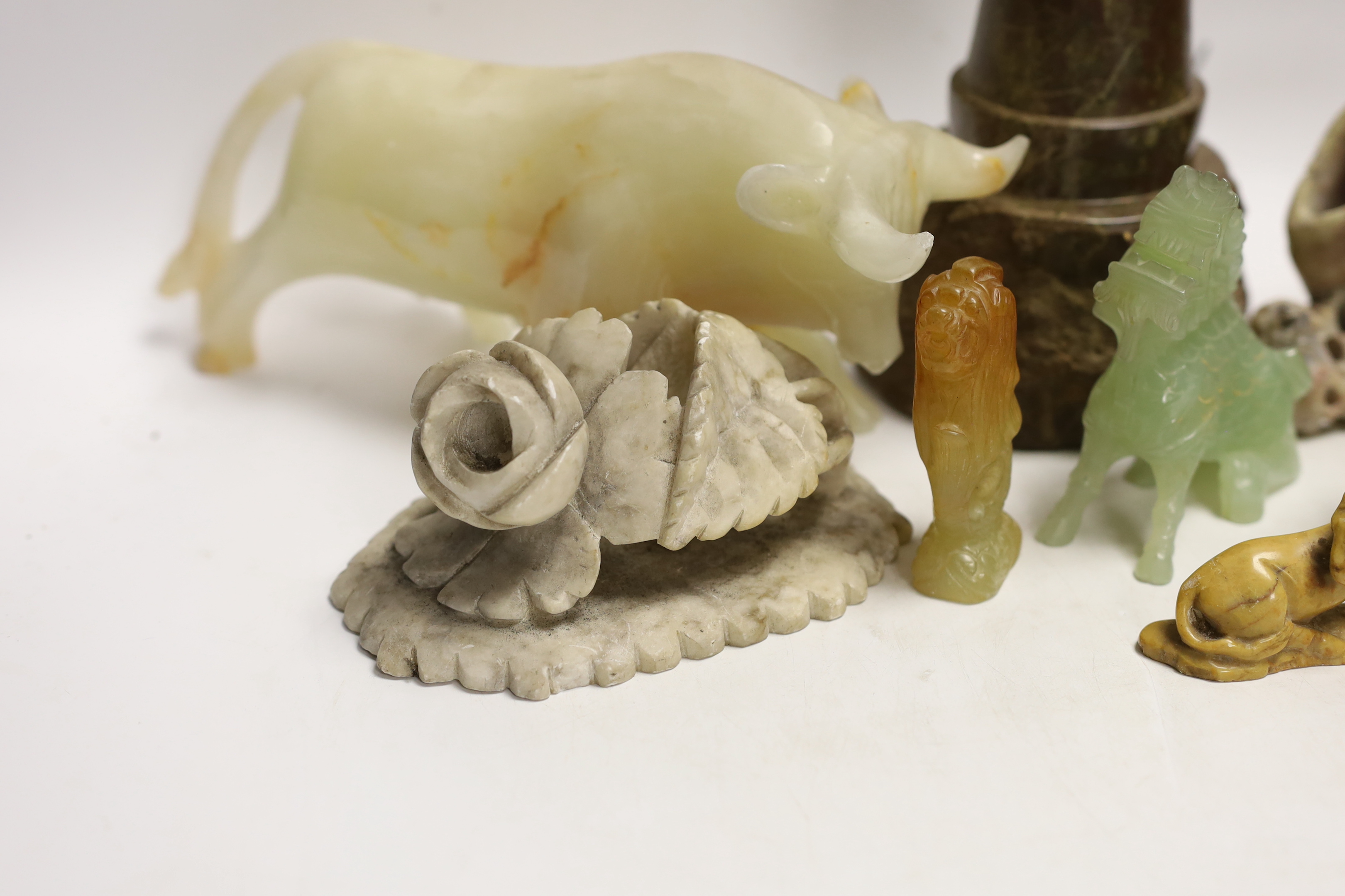 A Cornish serpentine novelty lighthouse lamp and mixed soapstone and hard stone carvings (12), lamp 25cm high